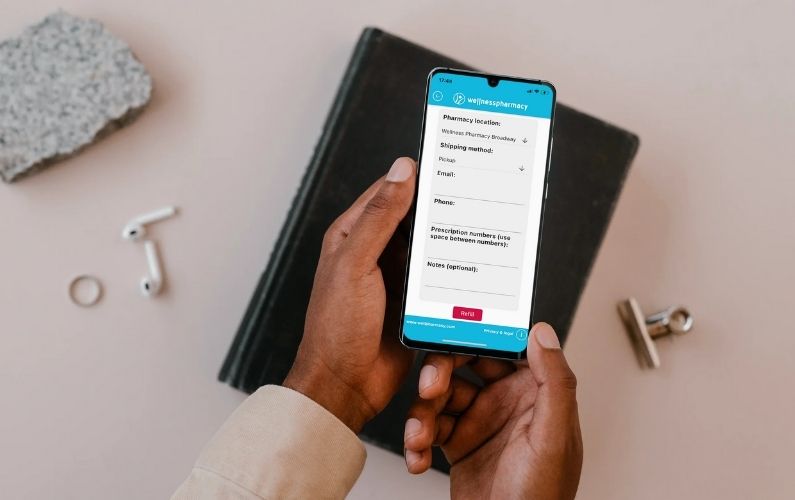 Someone using the Wellness Pharmacy 360 app on their smartphone