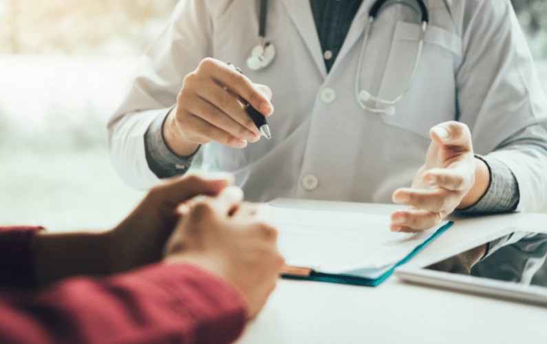 Pharmacist signing form for Hepatitis B vaccine