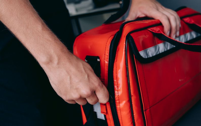 man stocking first aid kit